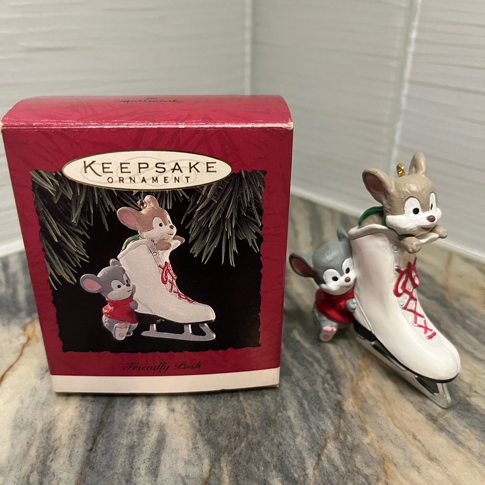 1994 Hallmark Keepsake Ornament titled "Friendly Push". With original box